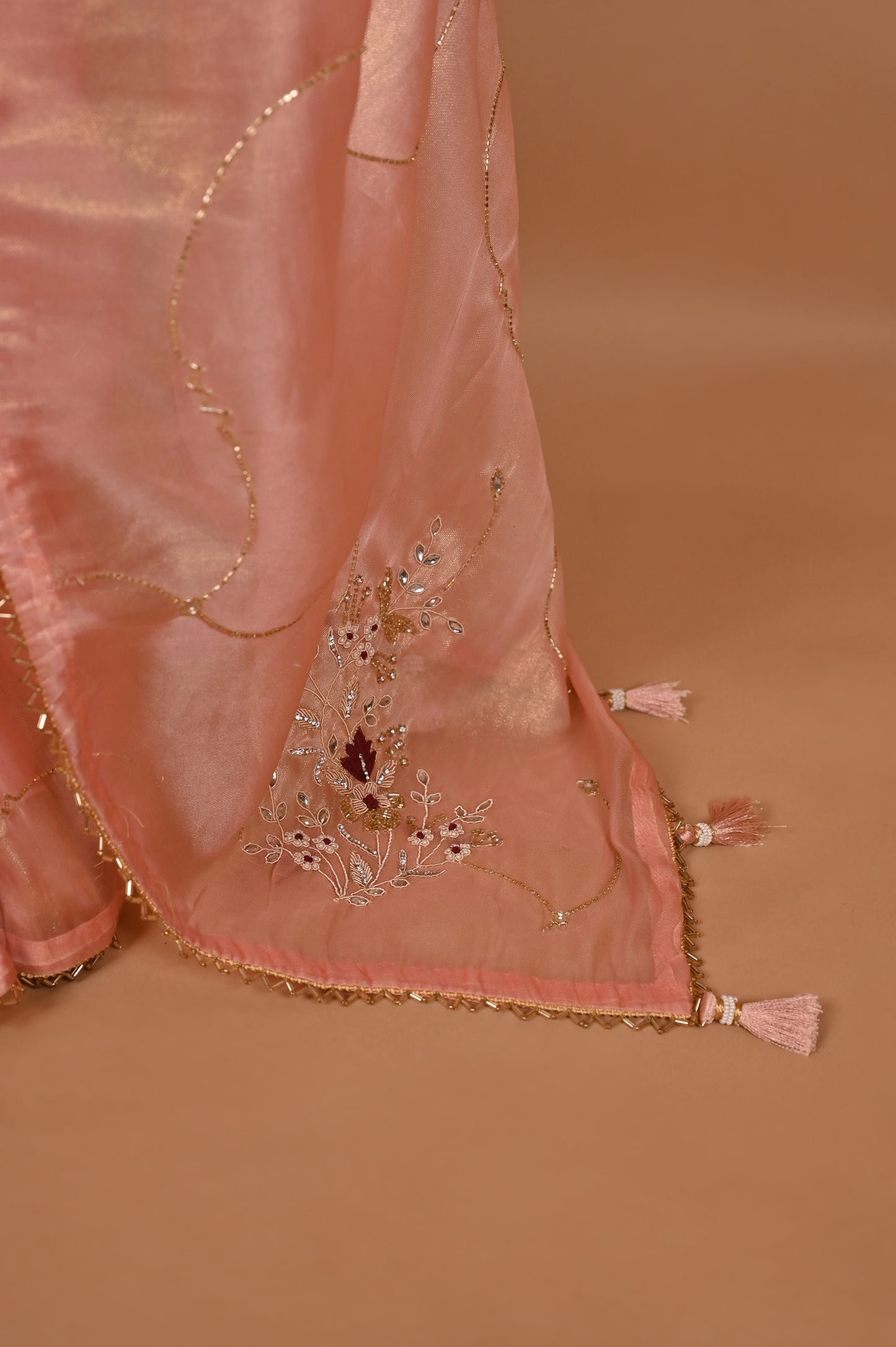 Peach Shimmer Saree with Zardozi Work and Gold Tassels
