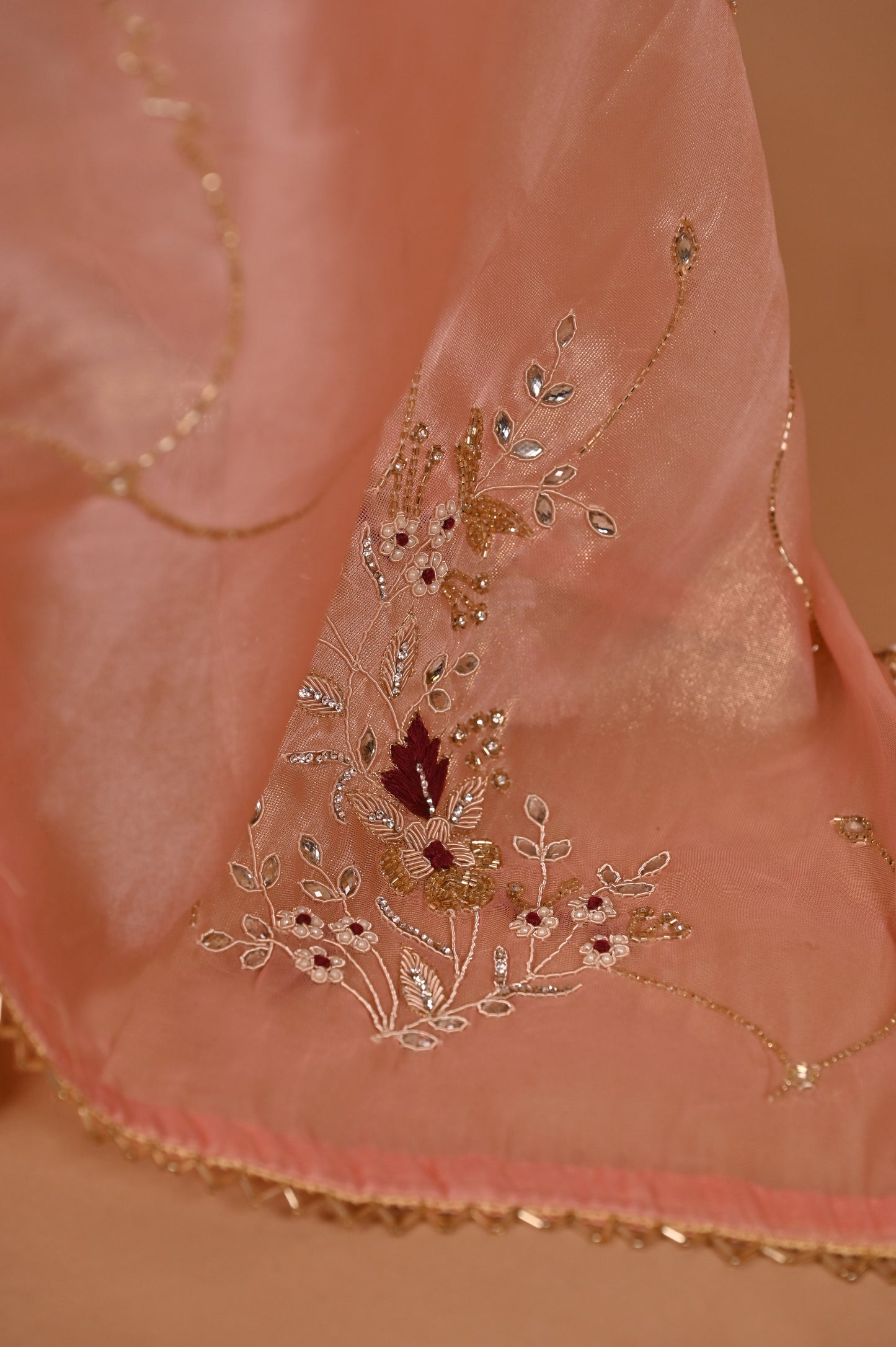 Peach Shimmer Saree with Zardozi Work and Gold Tassels