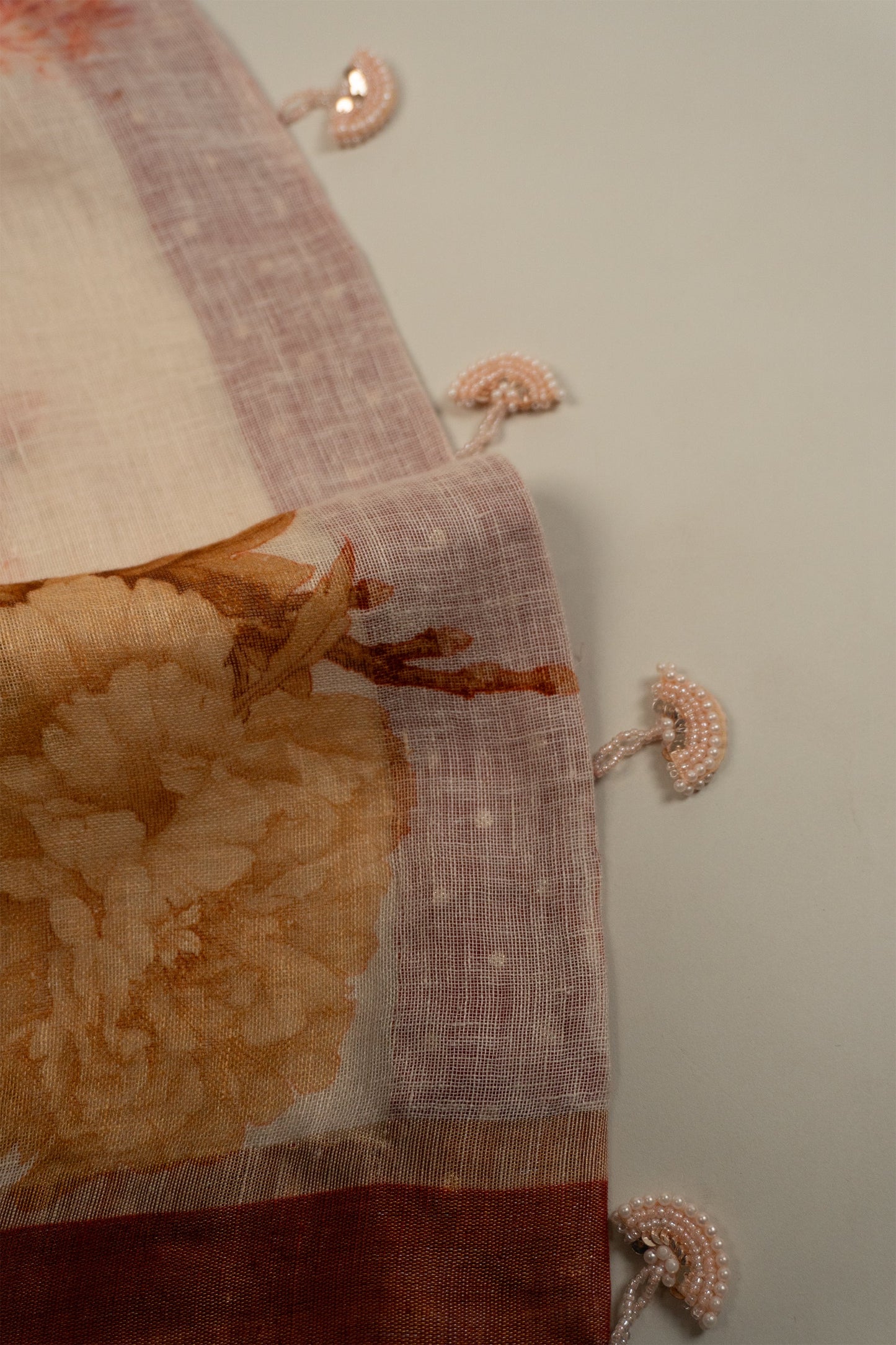 Cream and Maroon Linen Saree with Brocade Facing and Pearl Tassels on Pallu