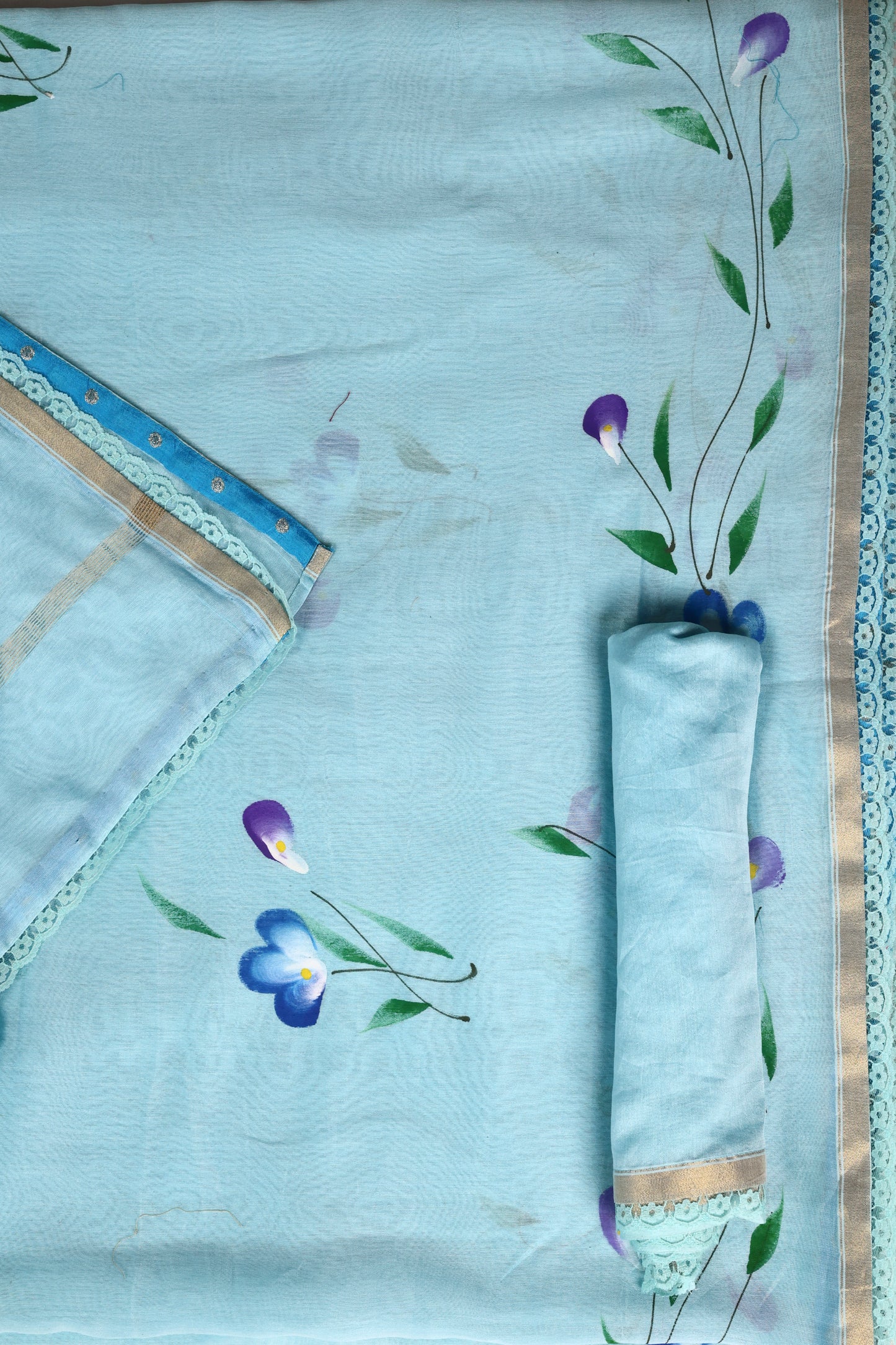 Sky Blue Hand‑Painted Cotton Saree with Lace Borders & Brocade Facing