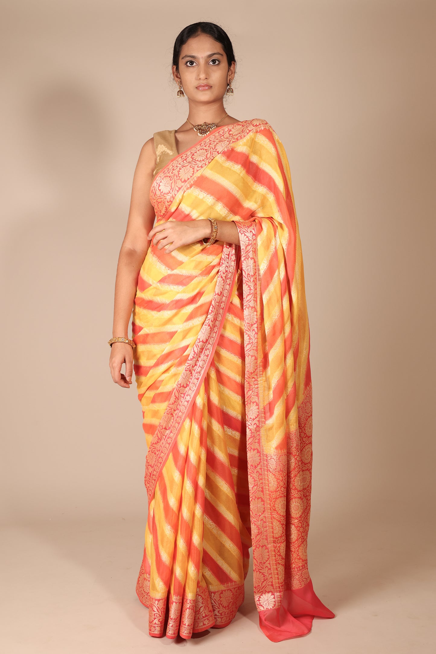 Vibrant Yellow and Coral Banarasi Crepe Georgette Saree with Diagonal Stripes