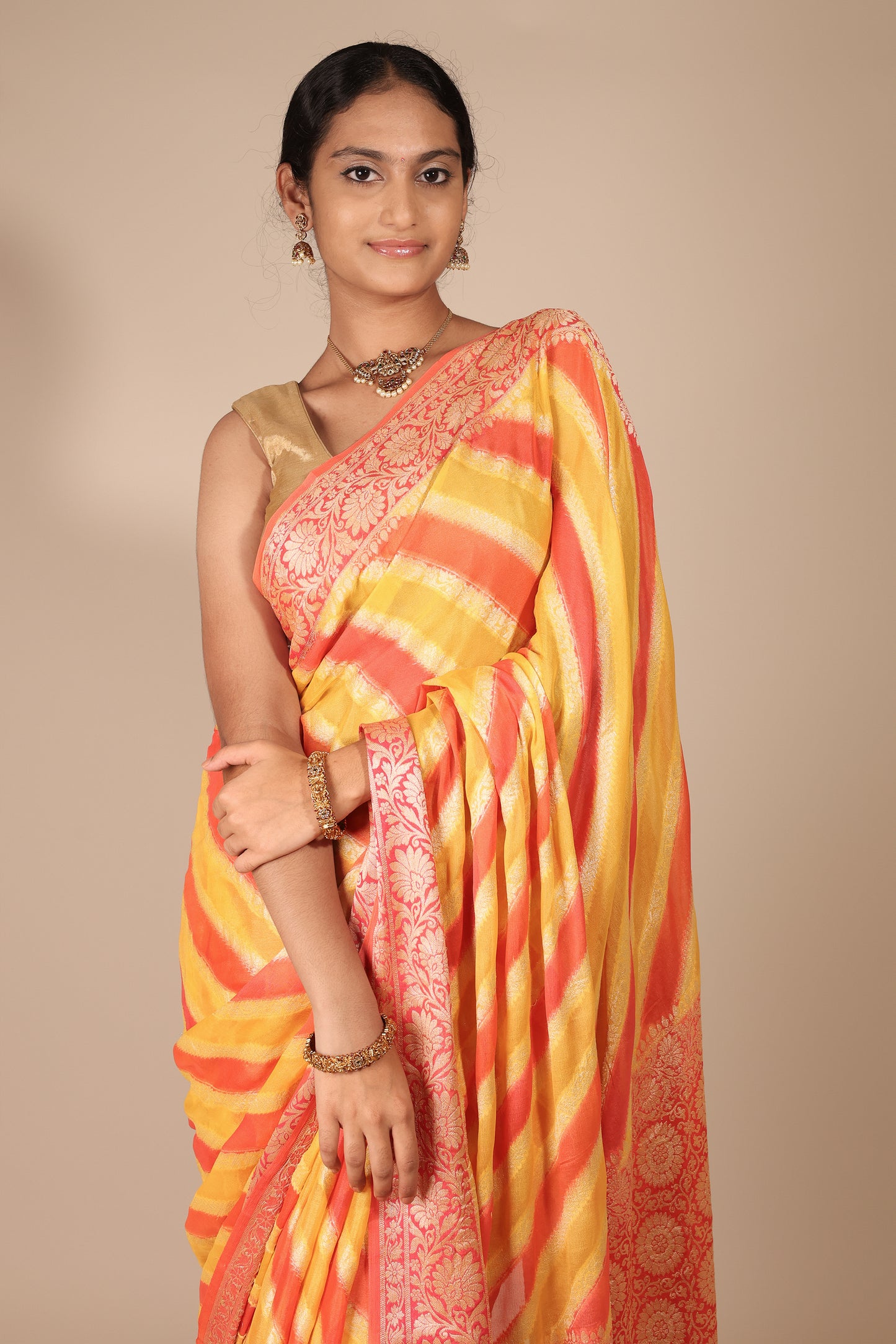 Vibrant Yellow and Coral Banarasi Crepe Georgette Saree with Diagonal Stripes