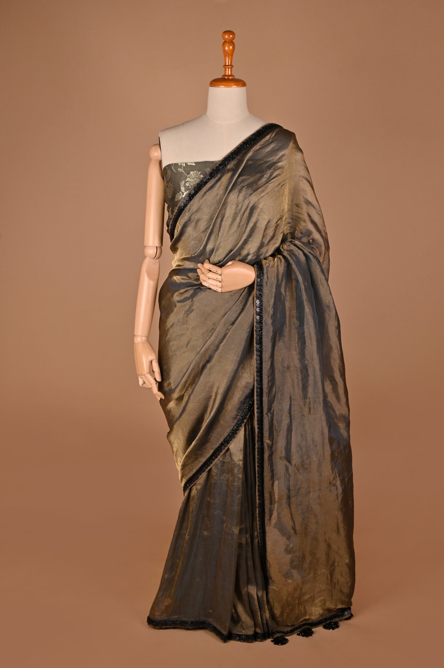 Sophisticated Grey Tissue Saree with Elegant Tassel Details