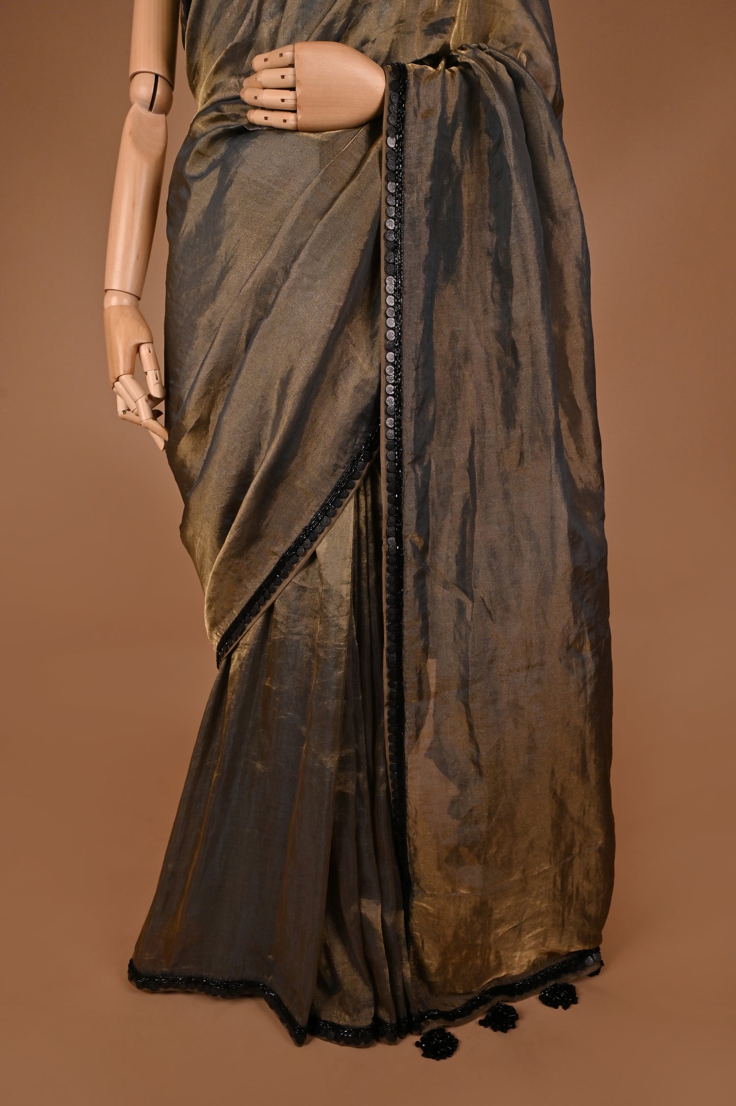 Sophisticated Grey Tissue Saree with Elegant Tassel Details