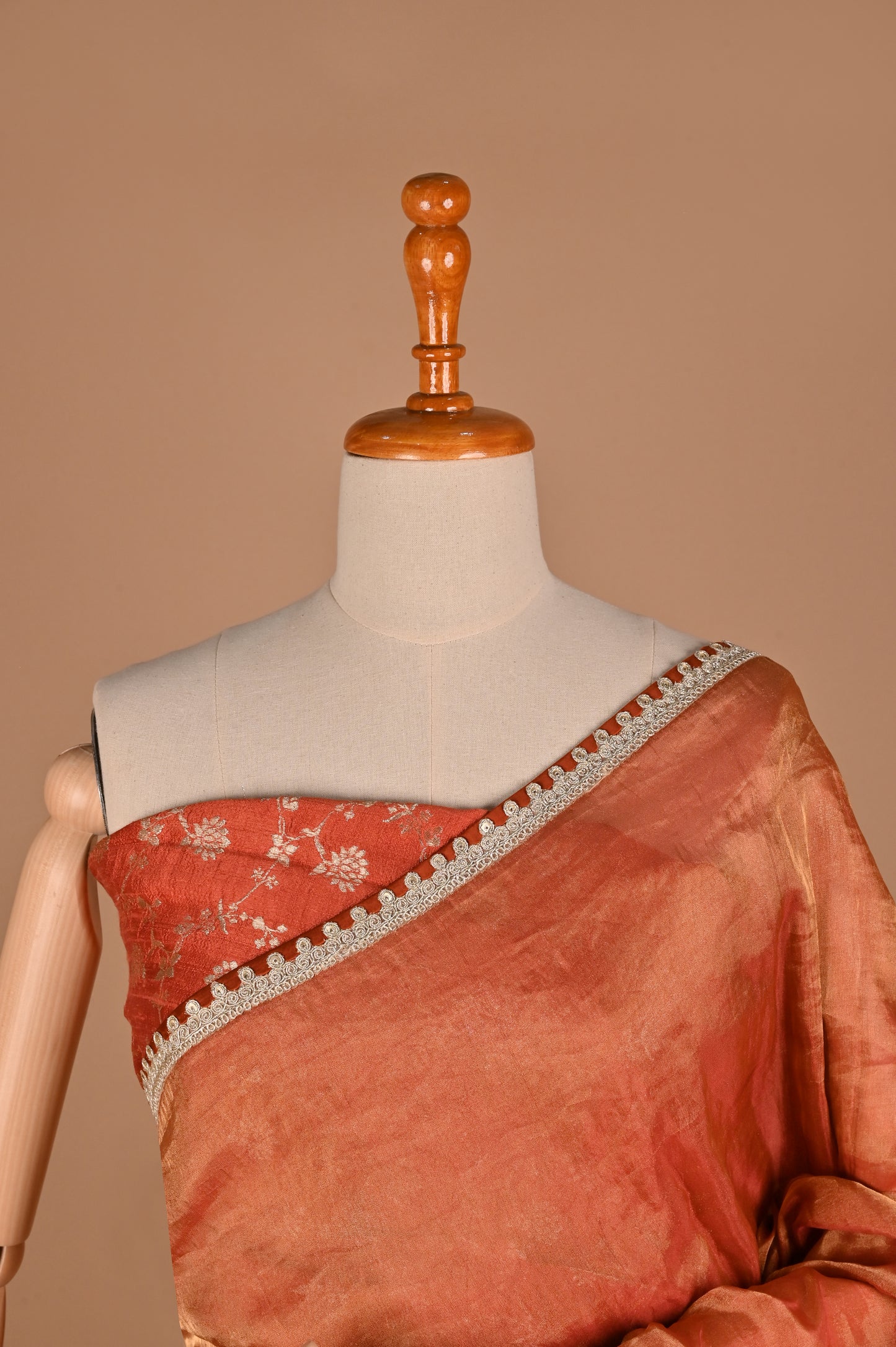 Earthy Rust Tissue Saree with Lace Border and Tassel Details