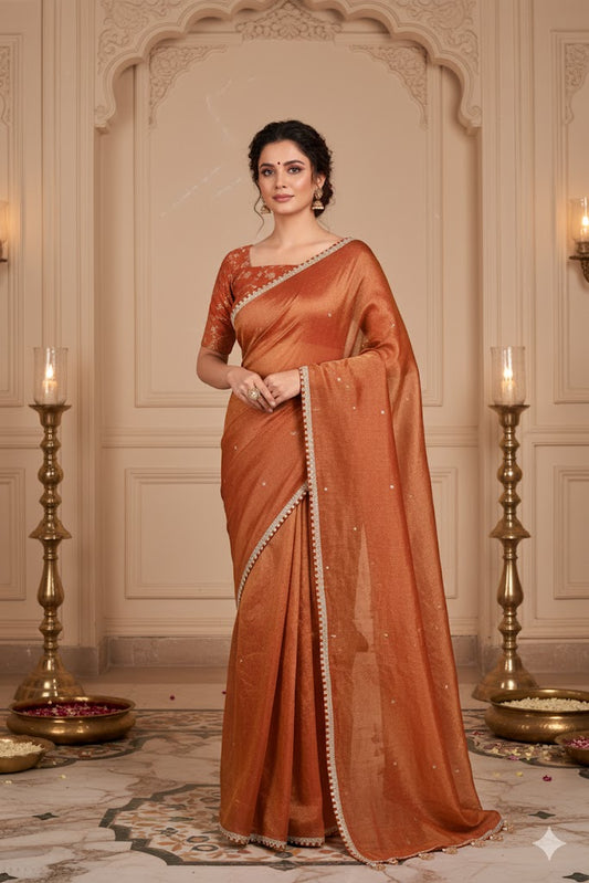 Earthy Rust Tissue Saree with Lace Border and Tassel Details