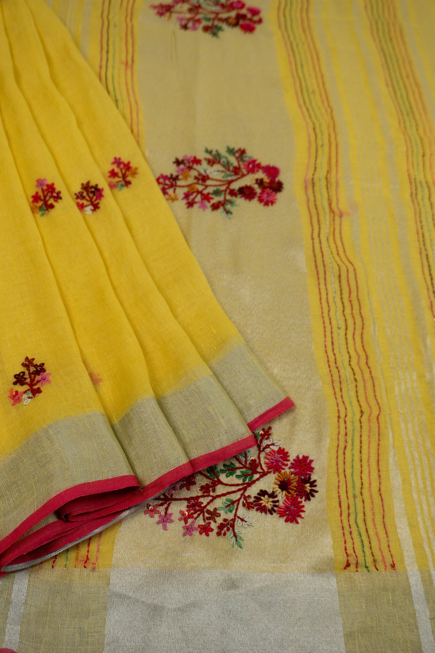Yellow and Magenta Linen Saree with Embroidered Floral Buttas