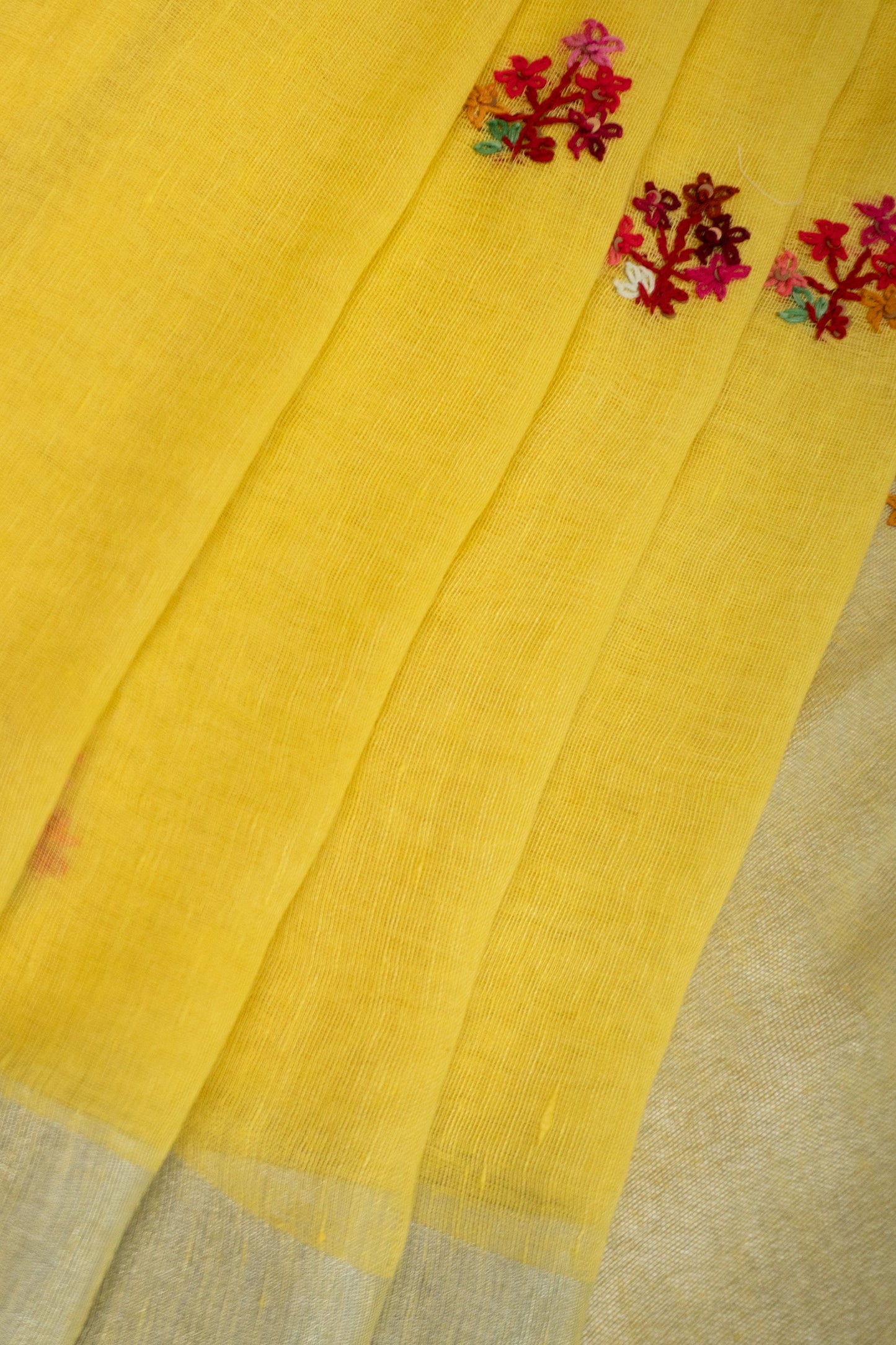 Yellow and Magenta Linen Saree with Embroidered Floral Buttas