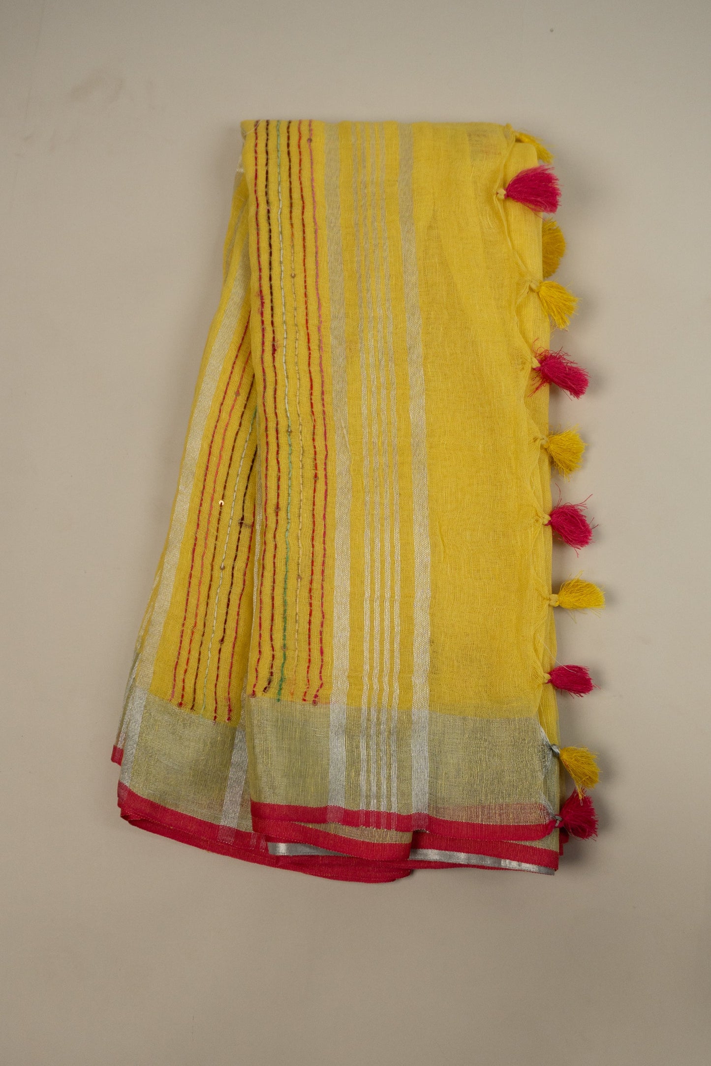 Yellow and Magenta Linen Saree with Embroidered Floral Buttas