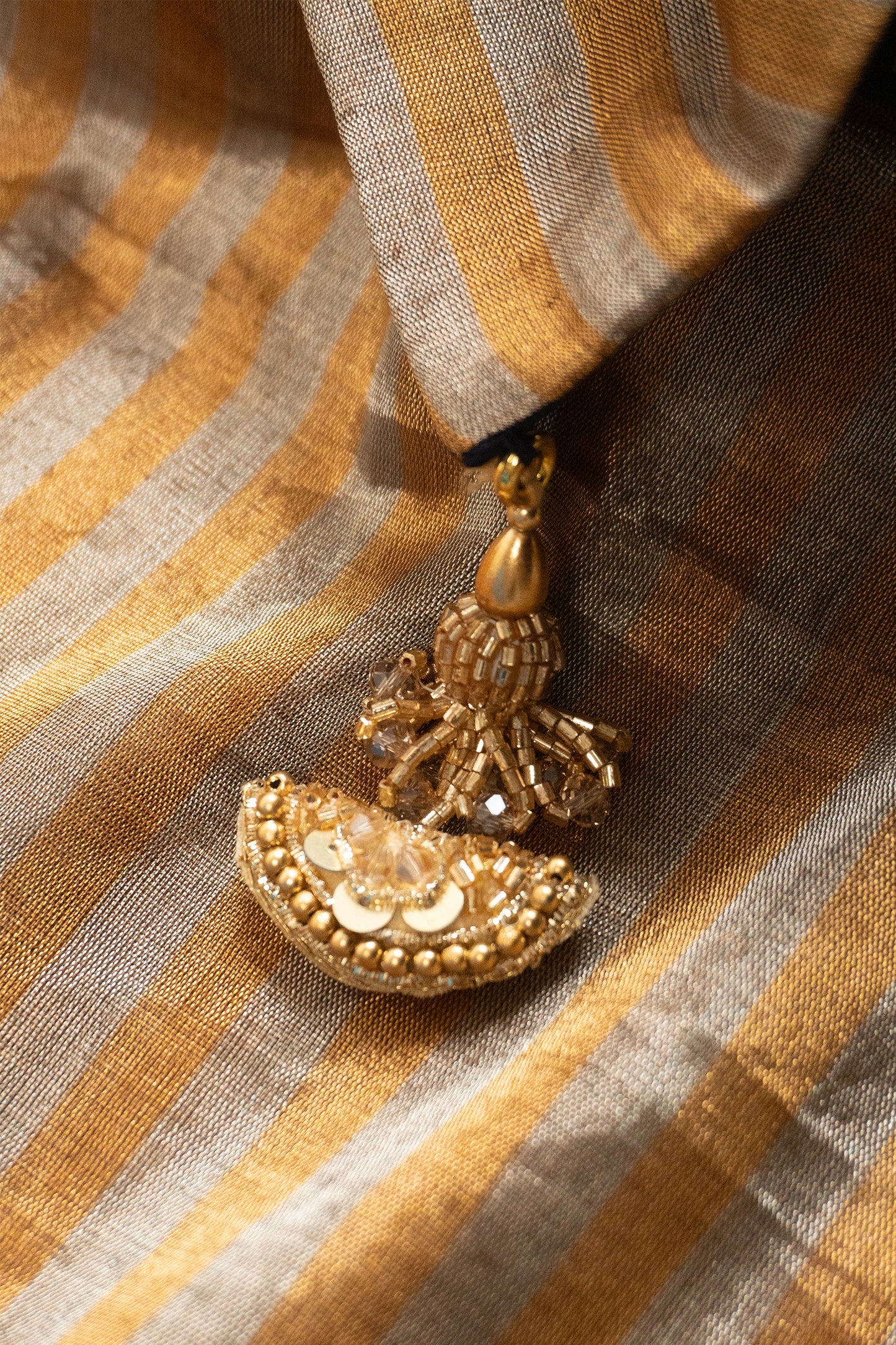 Gold Chanderi Silk Tissue Saree with Stripe and Plain Effect, Brocade Silk Contrast Navy Blue Facing, and Katdana Tassels in Pallu and Blouse