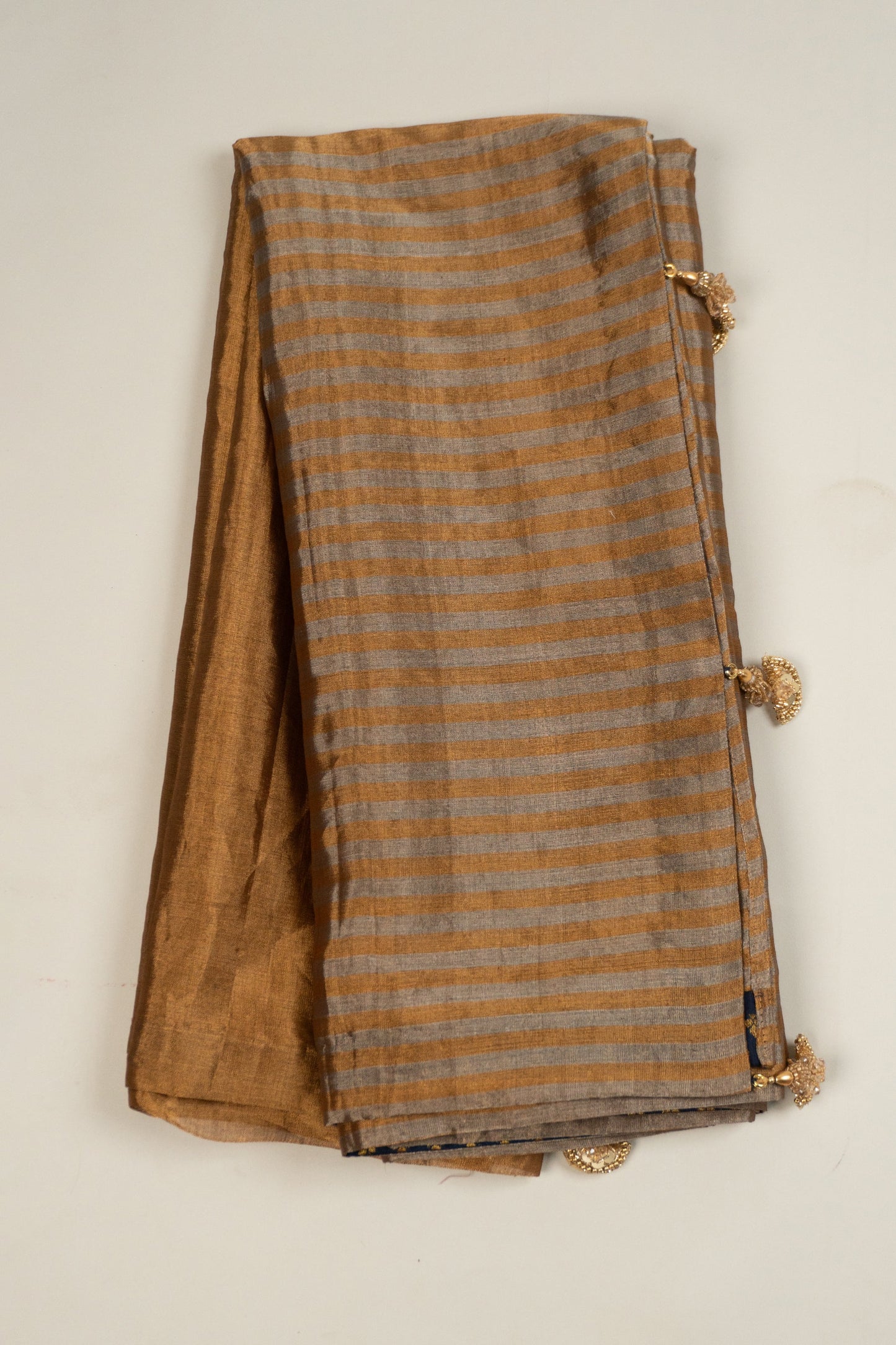 Gold Chanderi Silk Tissue Saree with Stripe and Plain Effect, Brocade Silk Contrast Navy Blue Facing, and Katdana Tassels in Pallu and Blouse