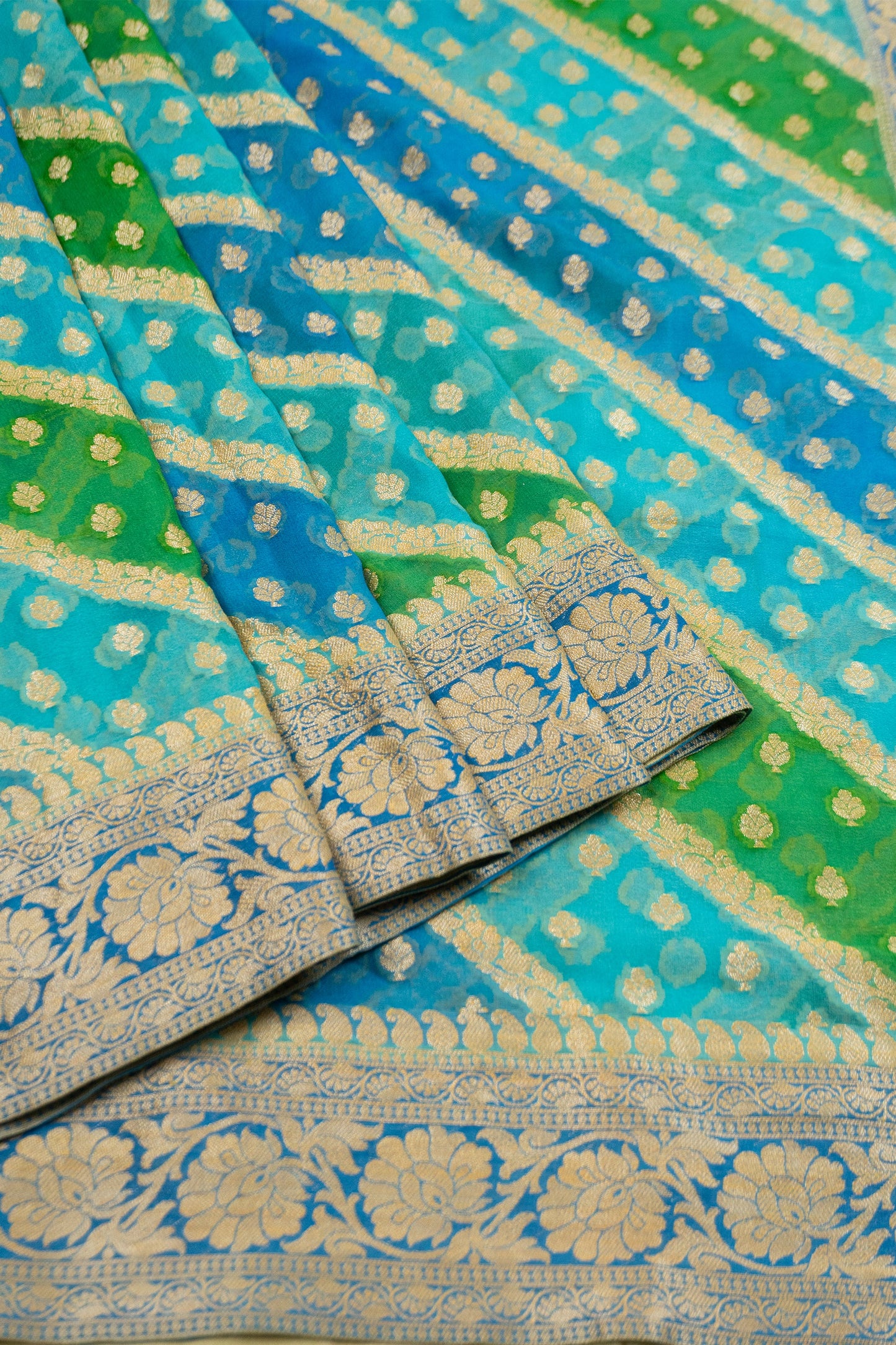 Multi-Colored Banarasi Silk Georgette Saree in Blue and Green with Gold Tissue Facing, Zari, and Pearl Tassels on Saree and Blouse