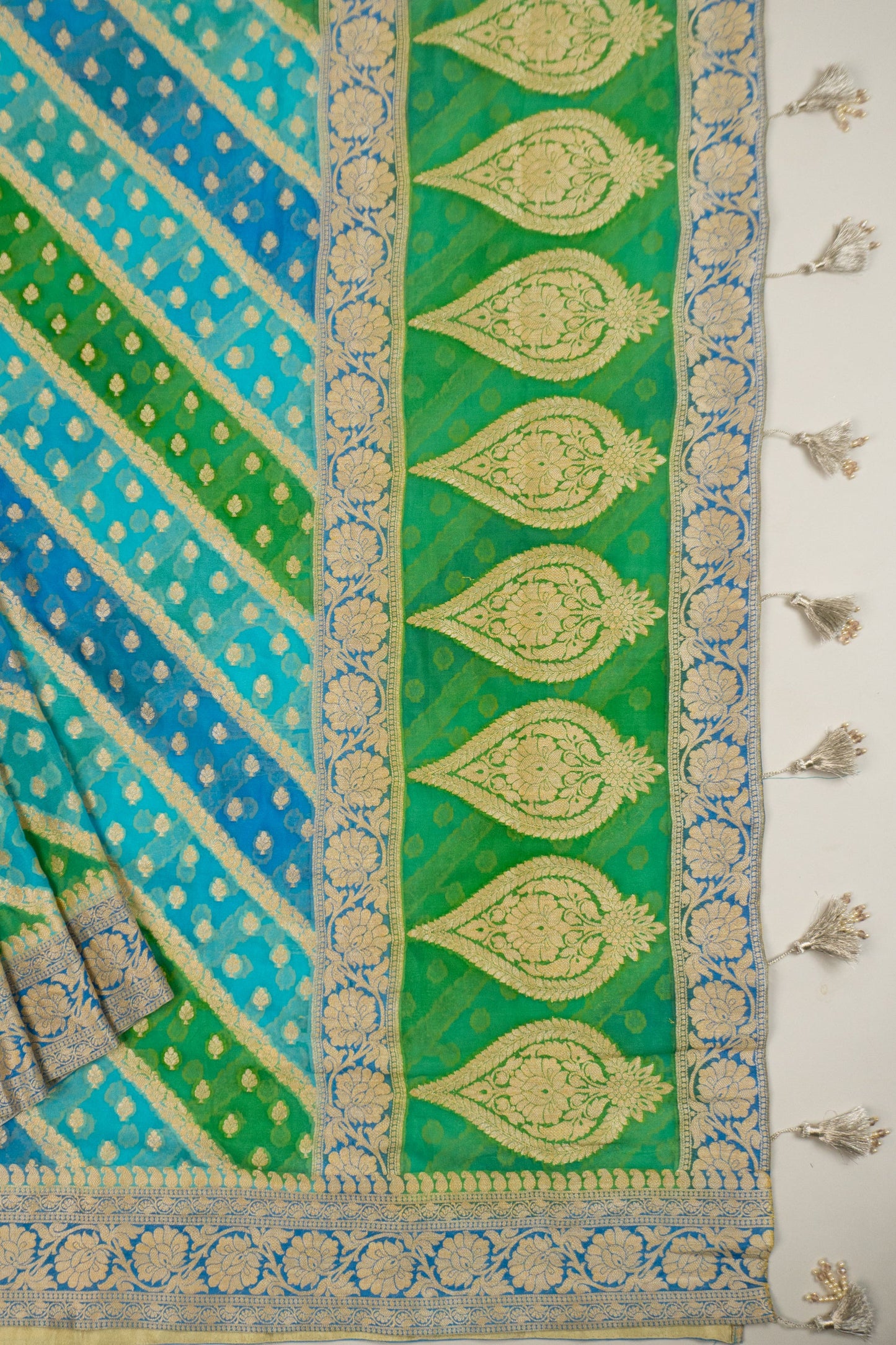 Multi-Colored Banarasi Silk Georgette Saree in Blue and Green with Gold Tissue Facing, Zari, and Pearl Tassels on Saree and Blouse