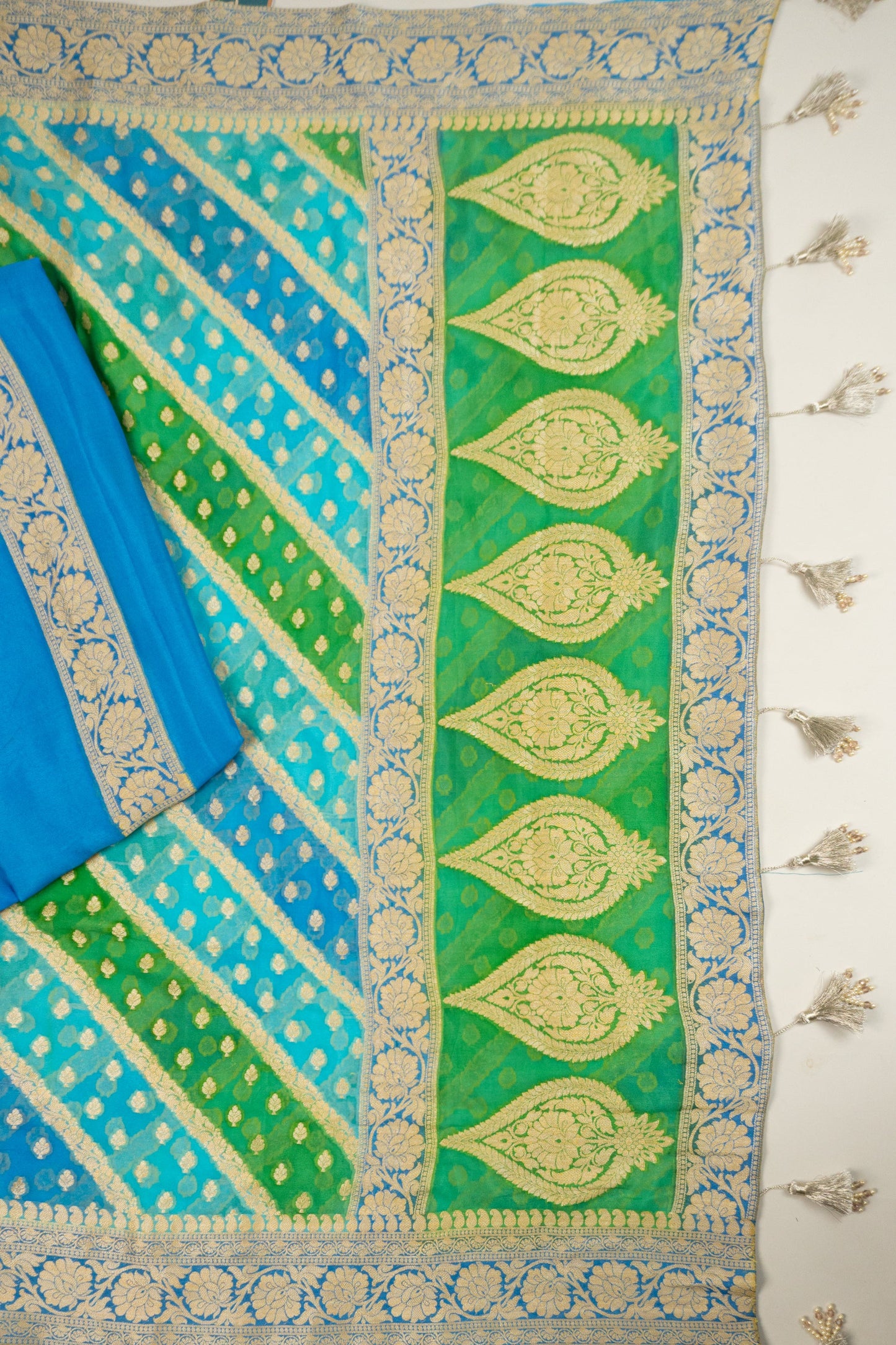 Multi-Colored Banarasi Silk Georgette Saree in Blue and Green with Gold Tissue Facing, Zari, and Pearl Tassels on Saree and Blouse