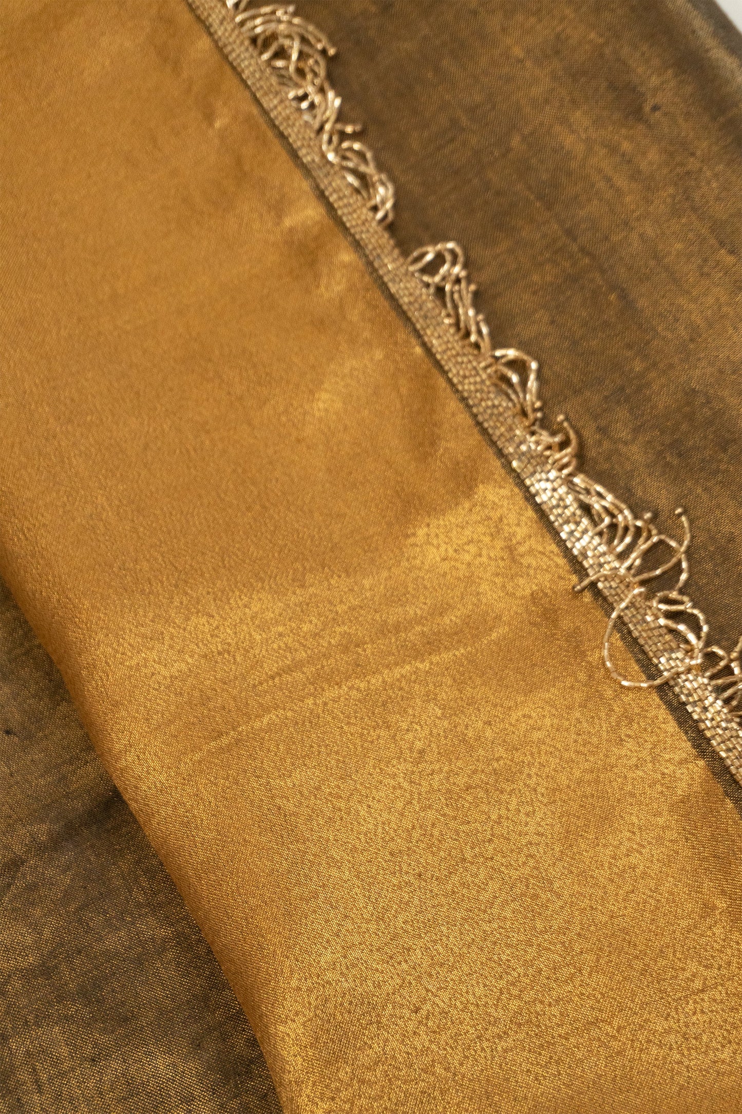 Metallic Gold Linen Saree with Brocade Facing and Decorative Hand-Embroidered Katdana Lace at the Pallu