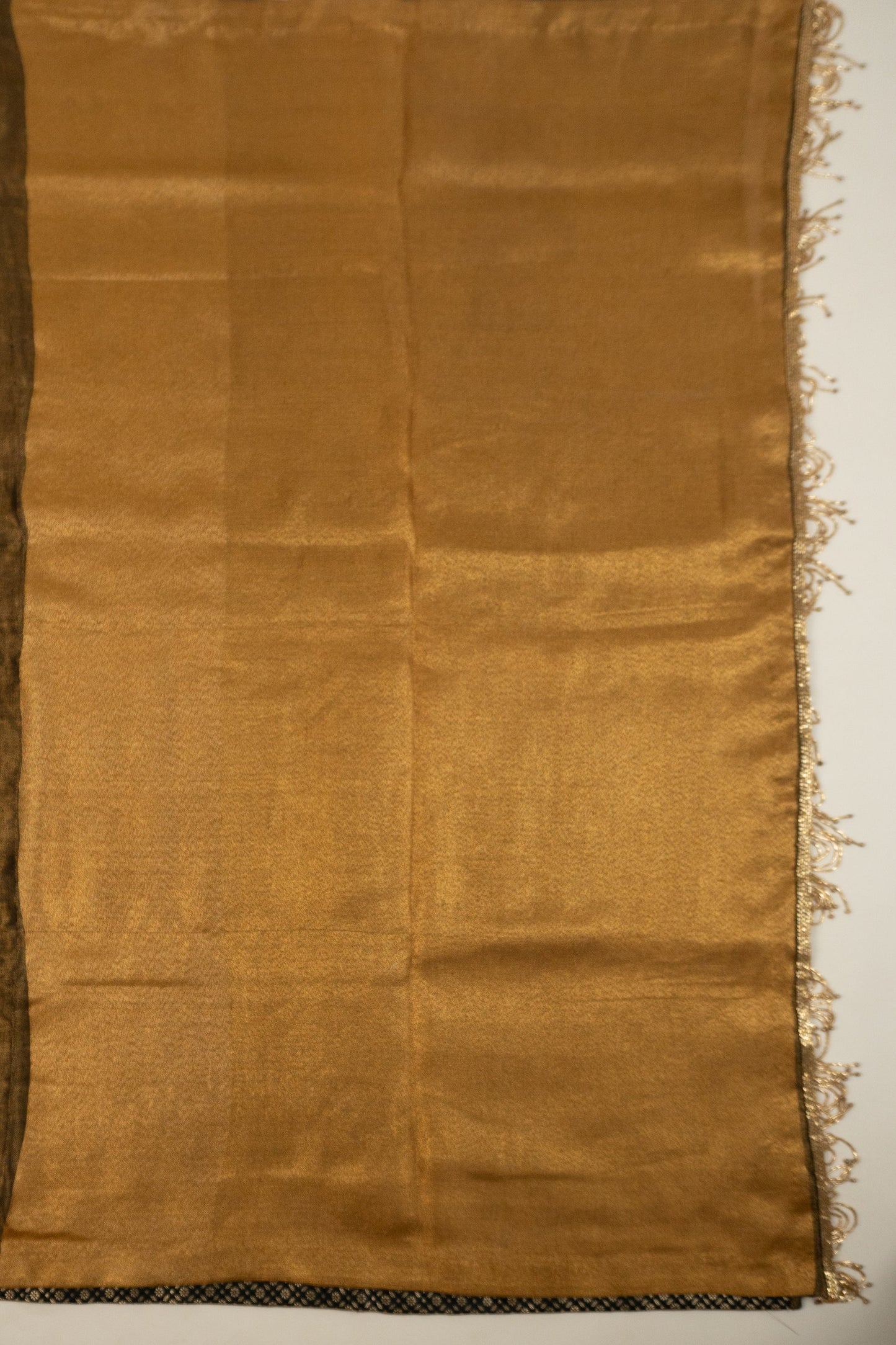 Metallic Gold Linen Saree with Brocade Facing and Decorative Hand-Embroidered Katdana Lace at the Pallu