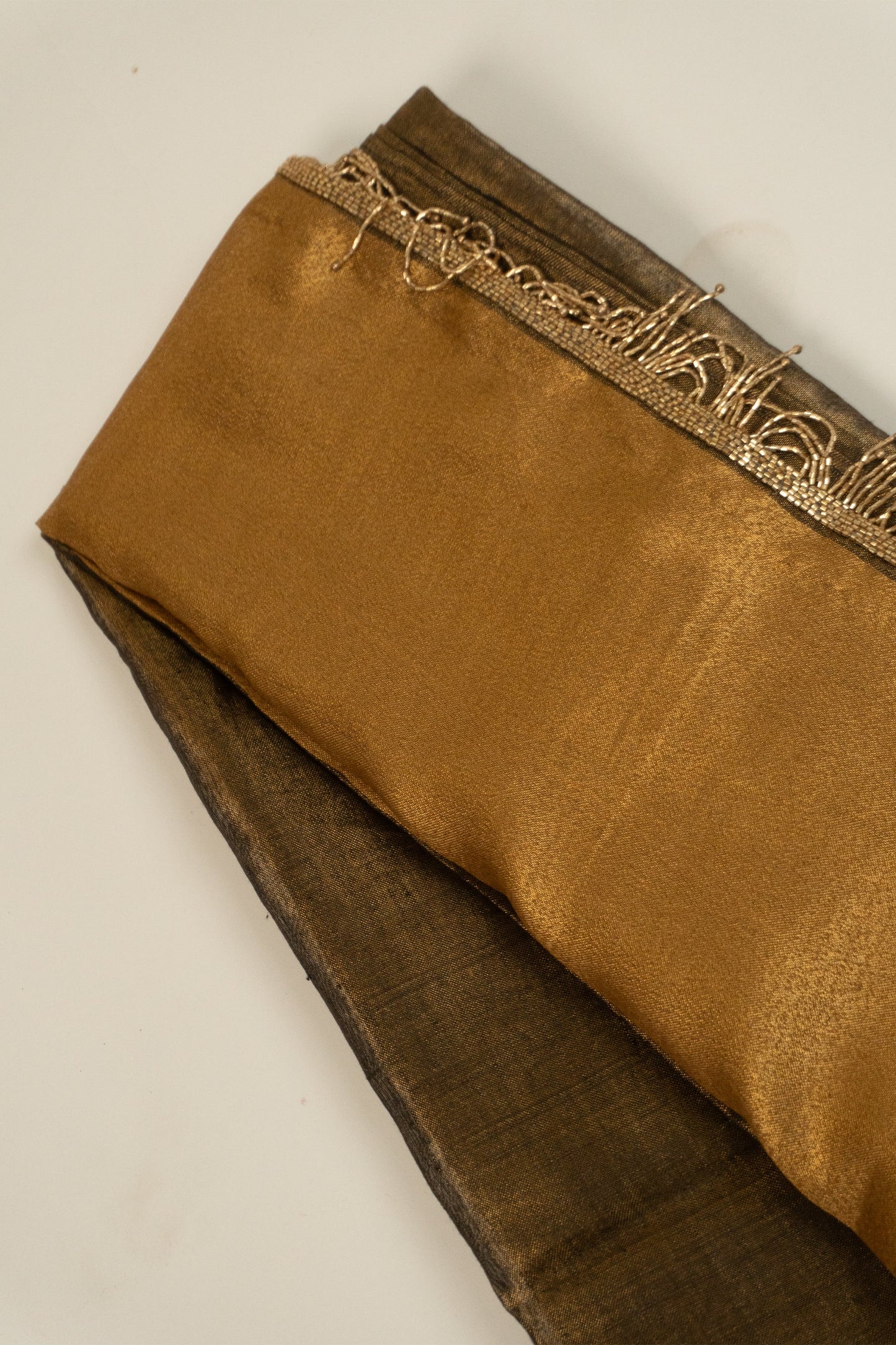 Metallic Gold Linen Saree with Brocade Facing and Decorative Hand-Embroidered Katdana Lace at the Pallu