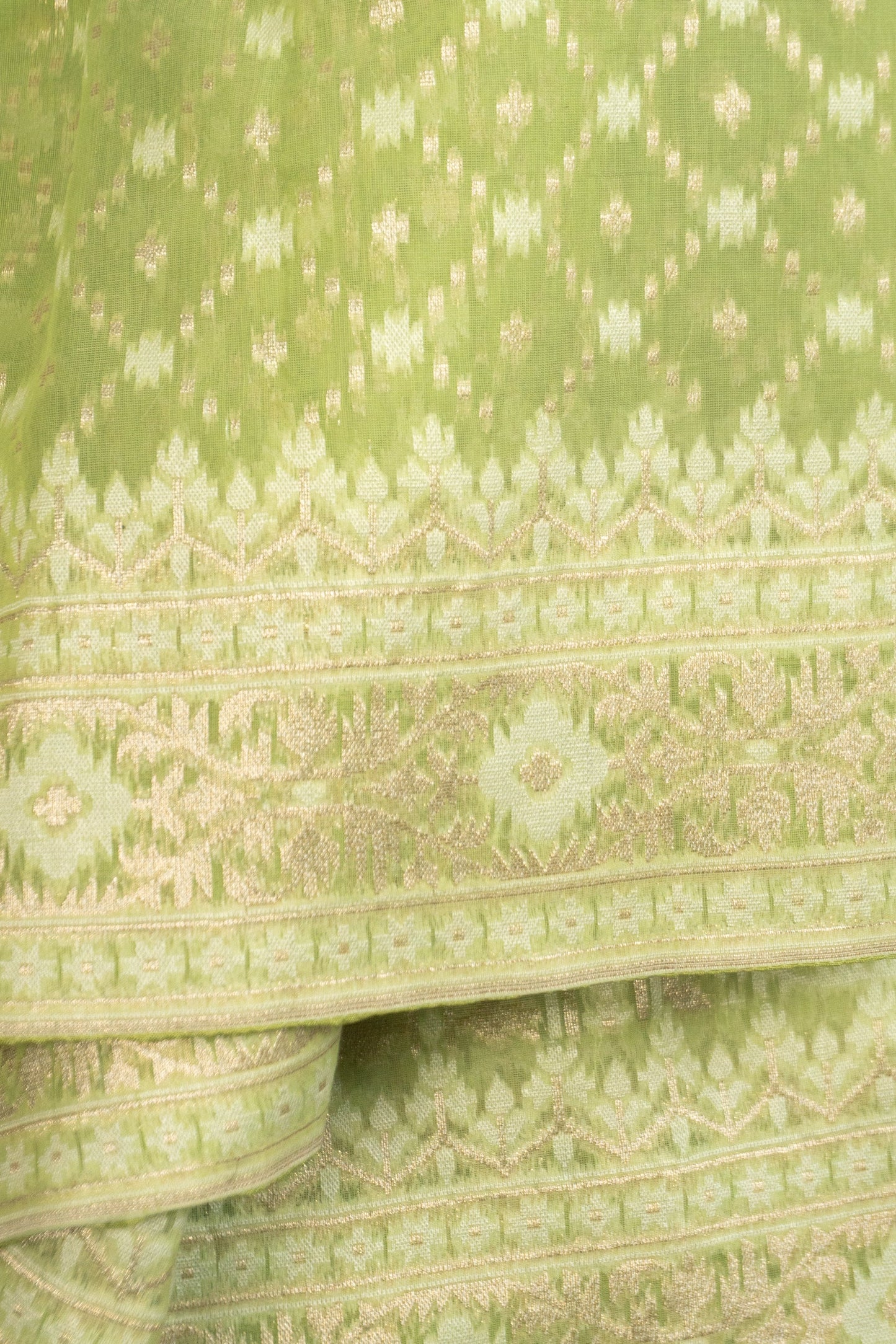 Pista Green Woven Organza Silk Saree with Intricate Diamond Pattern, Floral Border, Lurex Butta Facing, and Tassels on Saree and Blouse