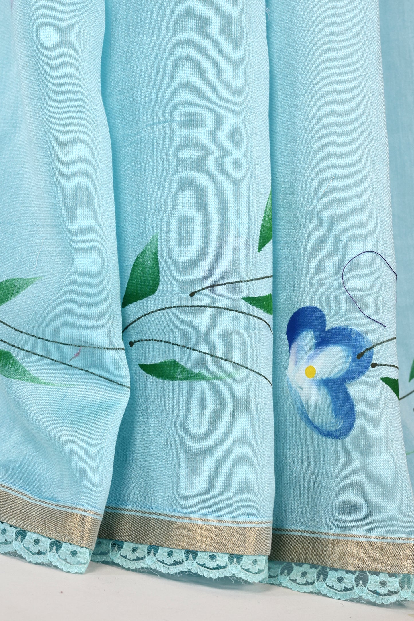 Sky Blue Hand‑Painted Cotton Saree with Lace Borders & Brocade Facing