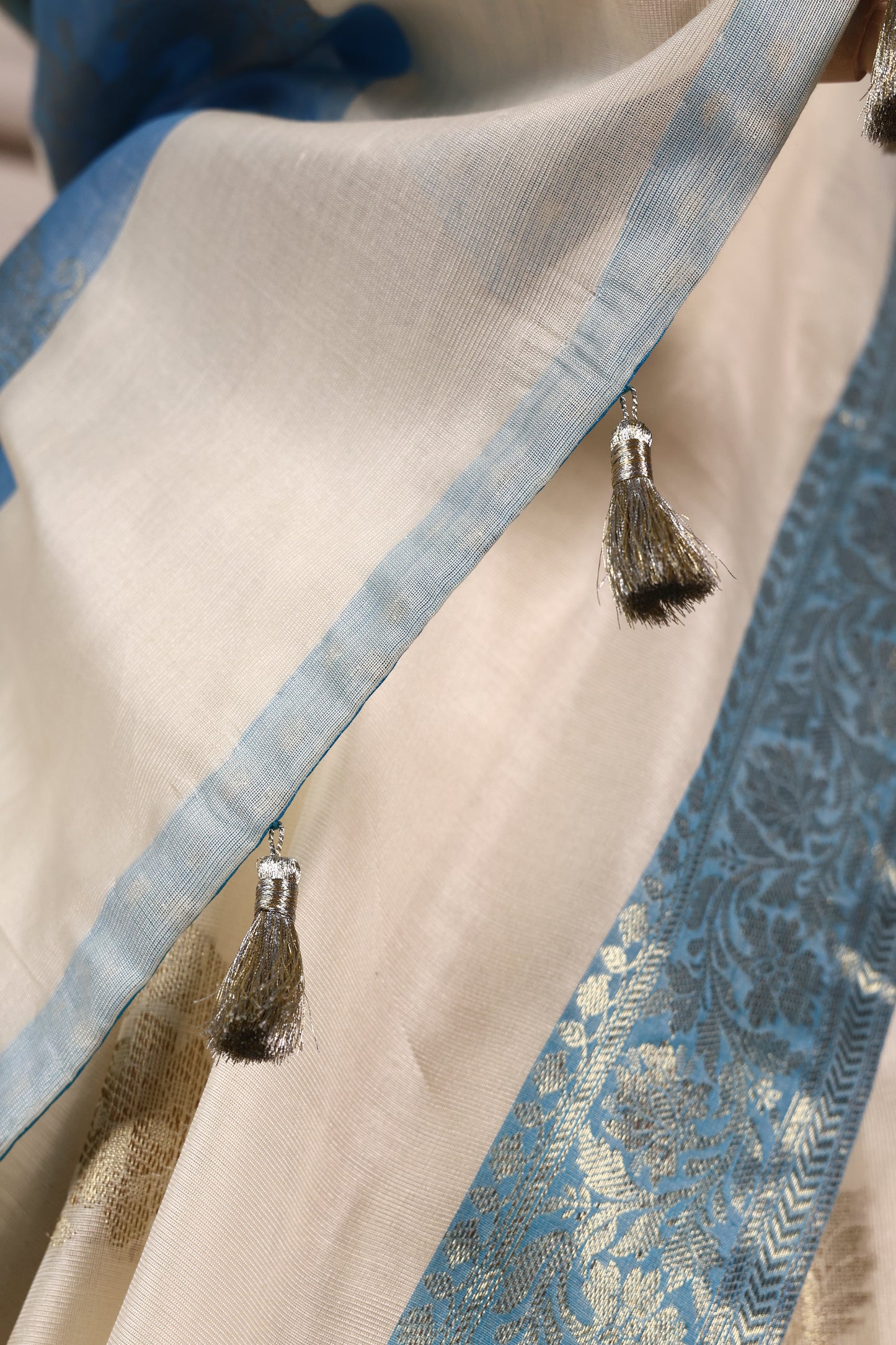 Off‑White & Sky Blue Banarasi Art Silk Saree with Intricate Weave, Brocade Facing & Zari Tassels