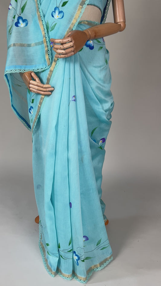 Sky Blue Hand‑Painted Cotton Saree with Lace Borders & Brocade Facing